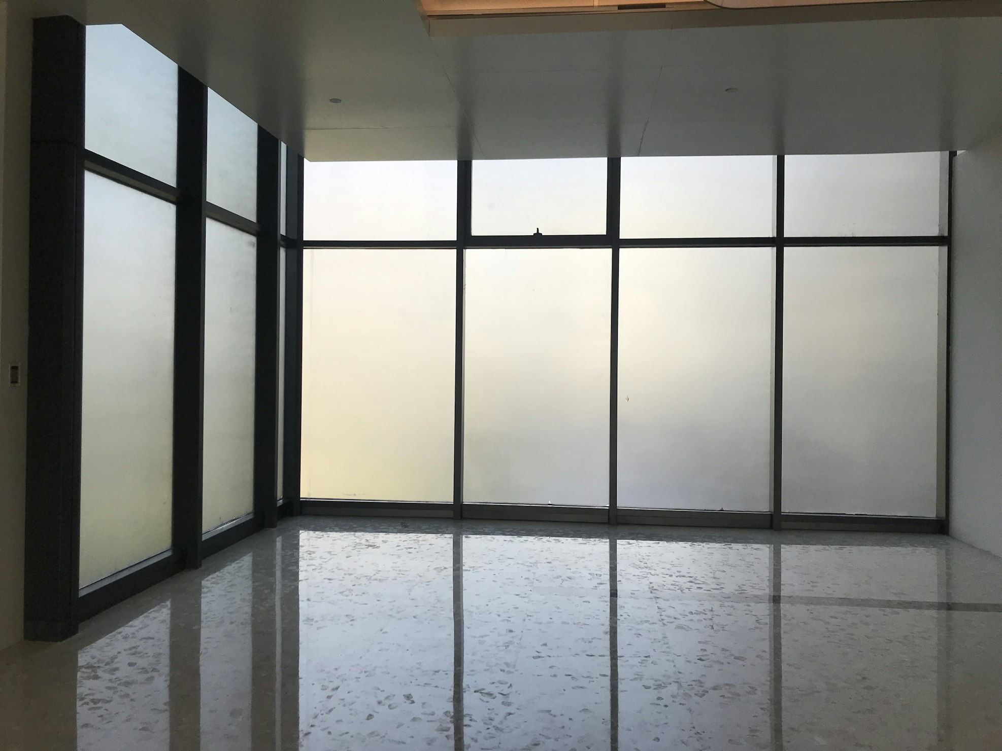 Gypsum partition wall creating private office space
